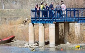 Police divers searching area of Golden Ponds in Longmont, Colorado. Courtesy of Daily Camera.
